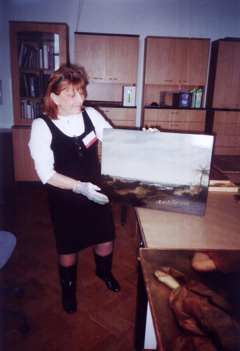 Zuzana Paternostro in the technical examination room observing works by Frans Post. Hermitage, Saint Petersburg, Russia, 2009.